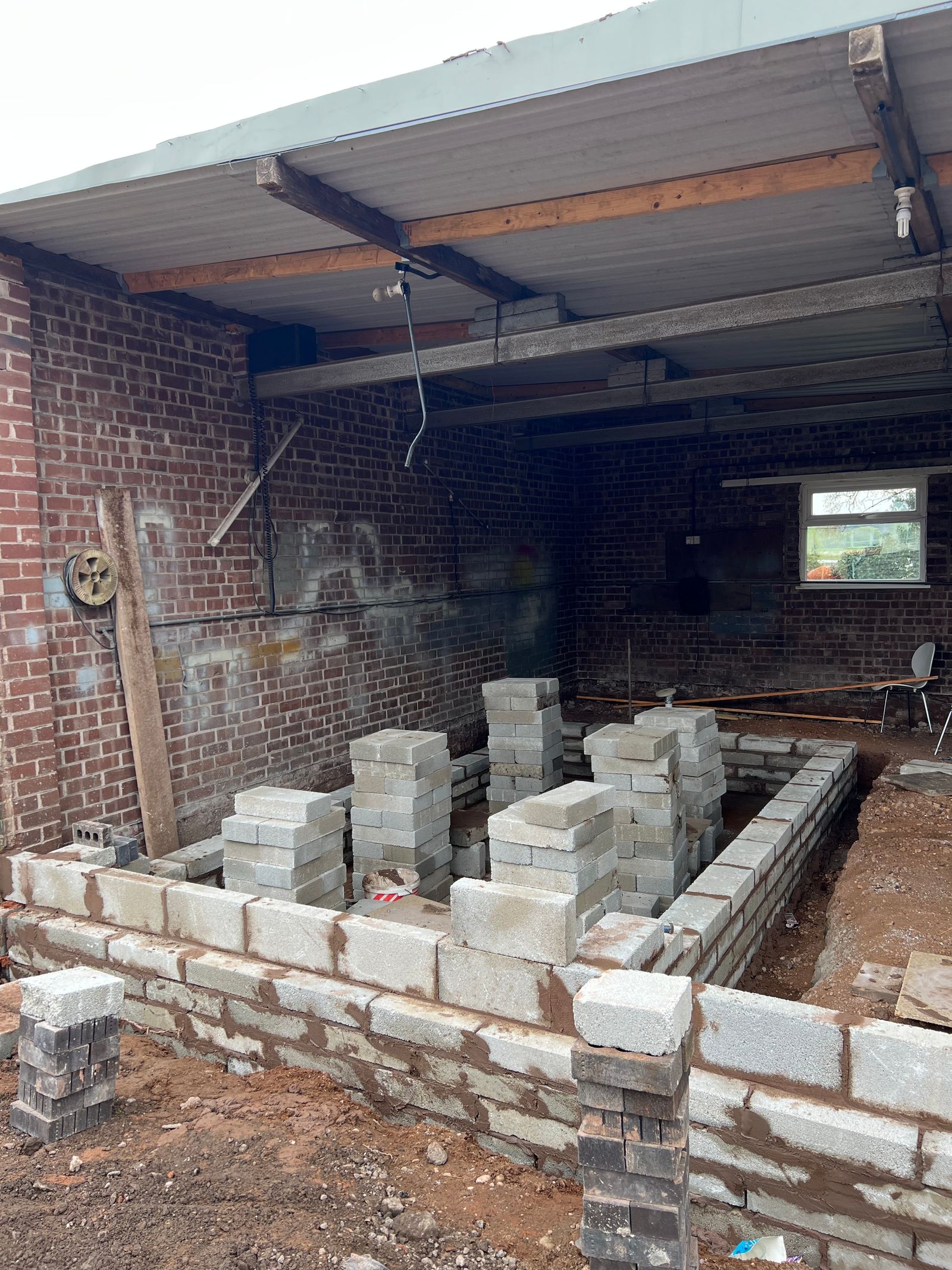 Construction of a retaining wall for the canine hydrotherapy pool.