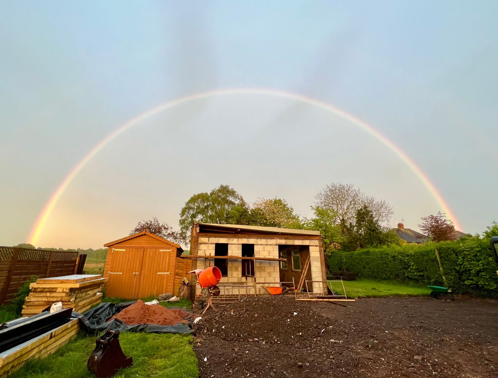 A rainbow across the building site of a dog rehabilitation centre.