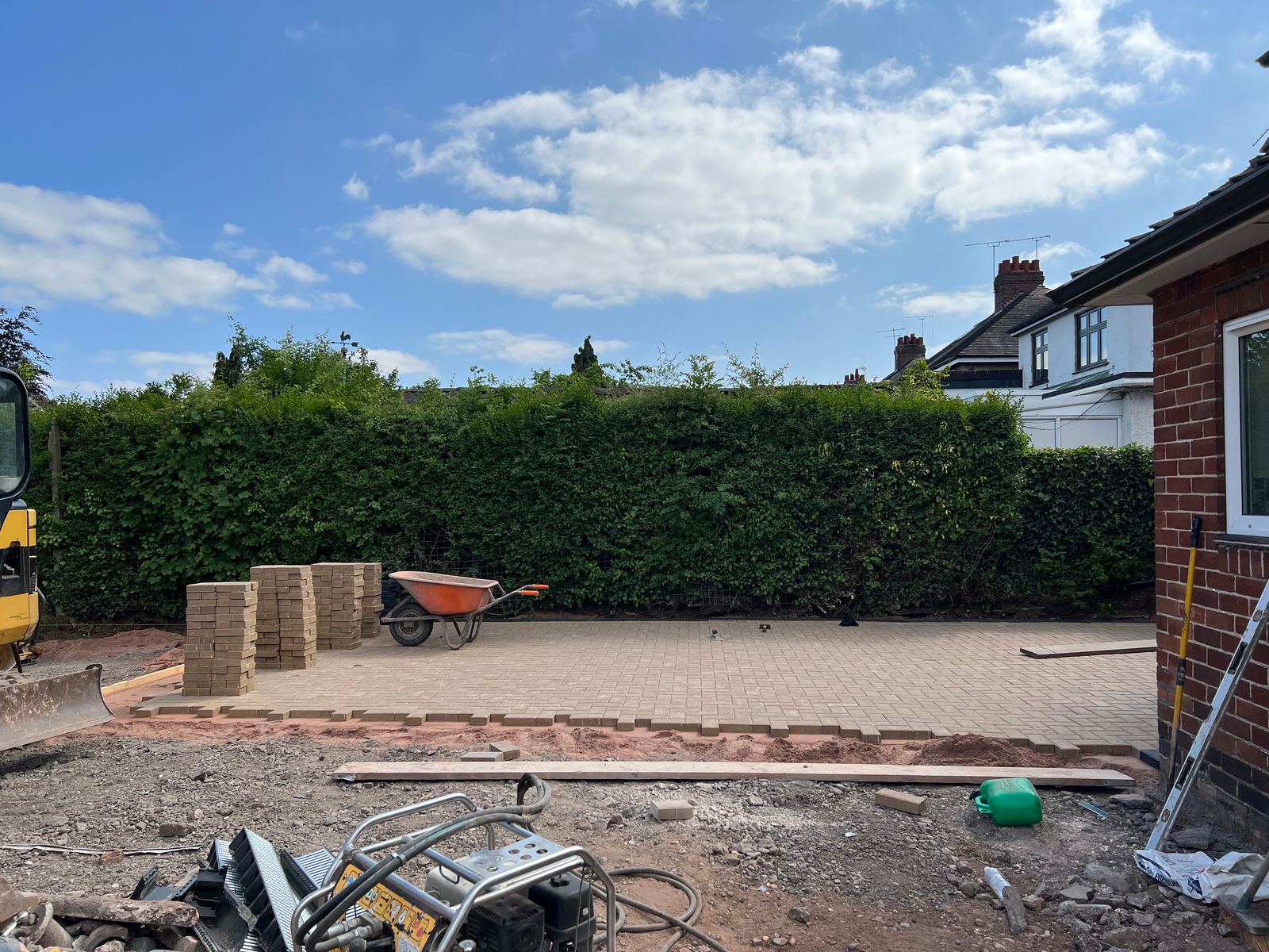 Construction of a paved driveway outside a canine hydrotherapy centre.